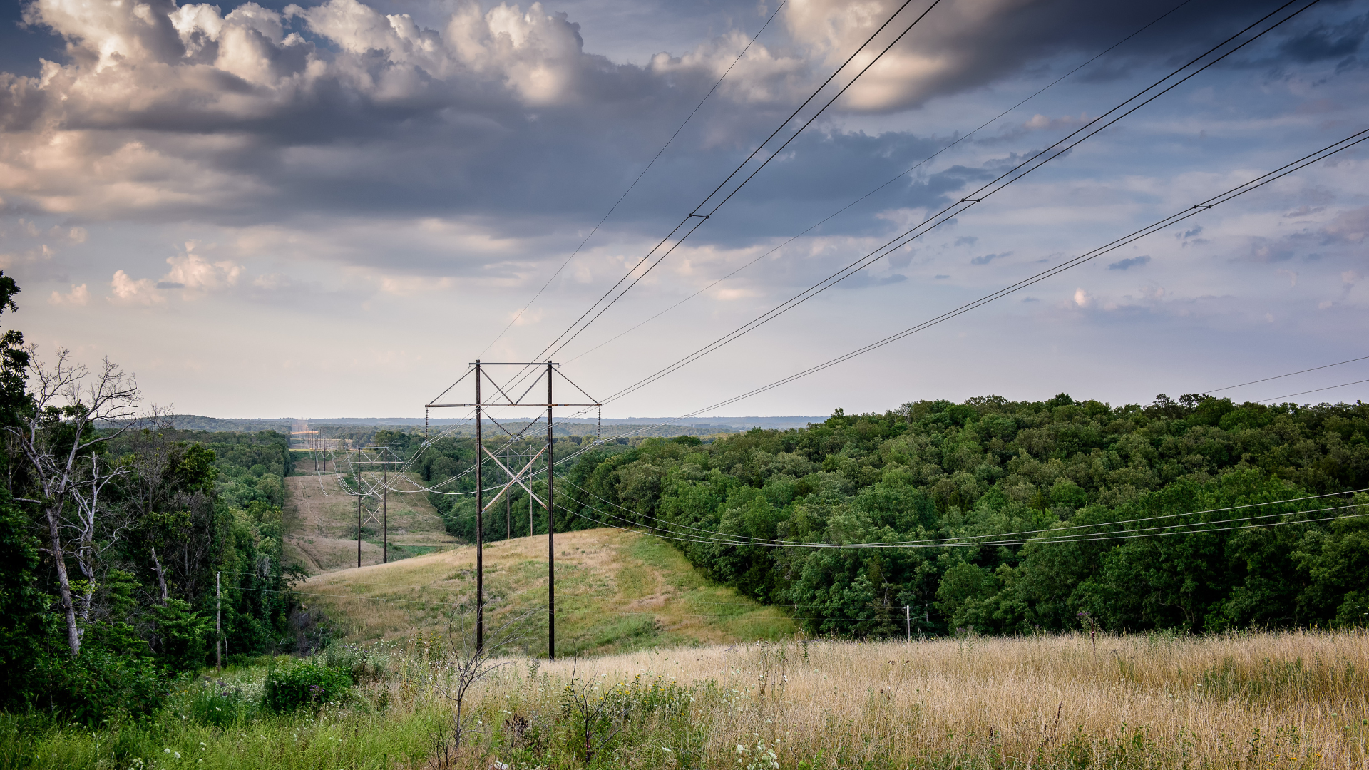 Transmission lines in a scenic hilly setting